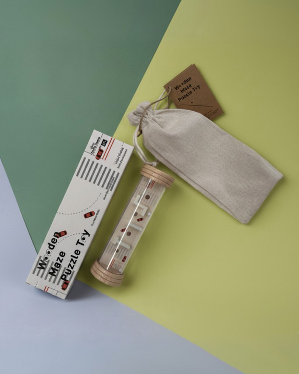 Rolling ball maze toy in green sports field pattern, packed in box and drawstring pouch.