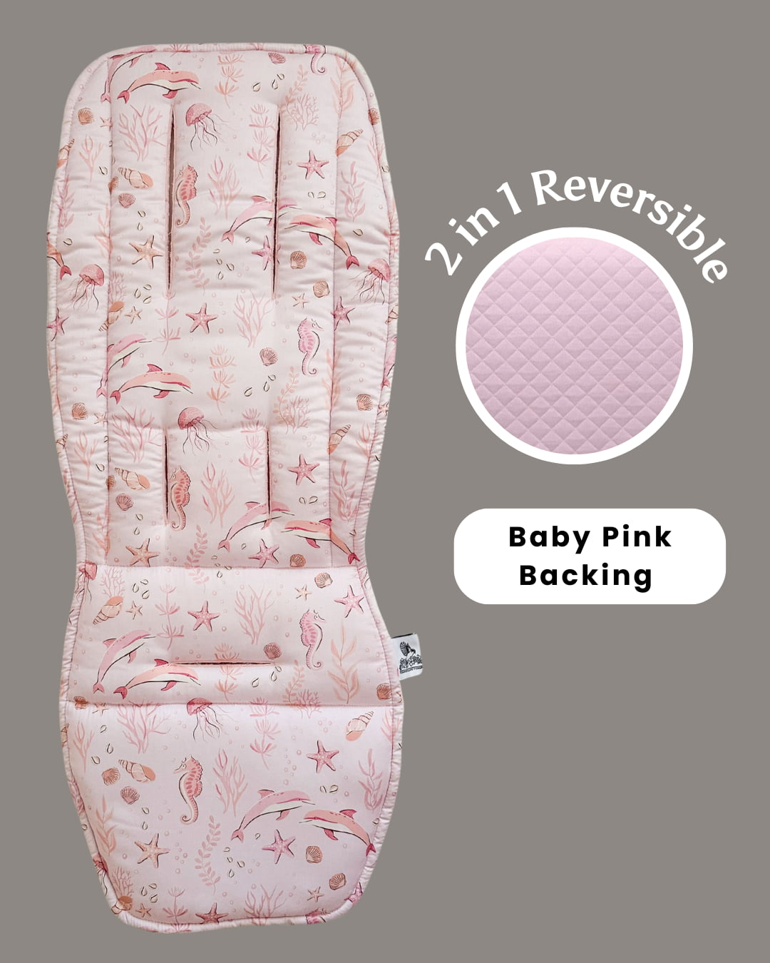 2-in-1 reversible baby seat cover with pink and white pattern on a gray background