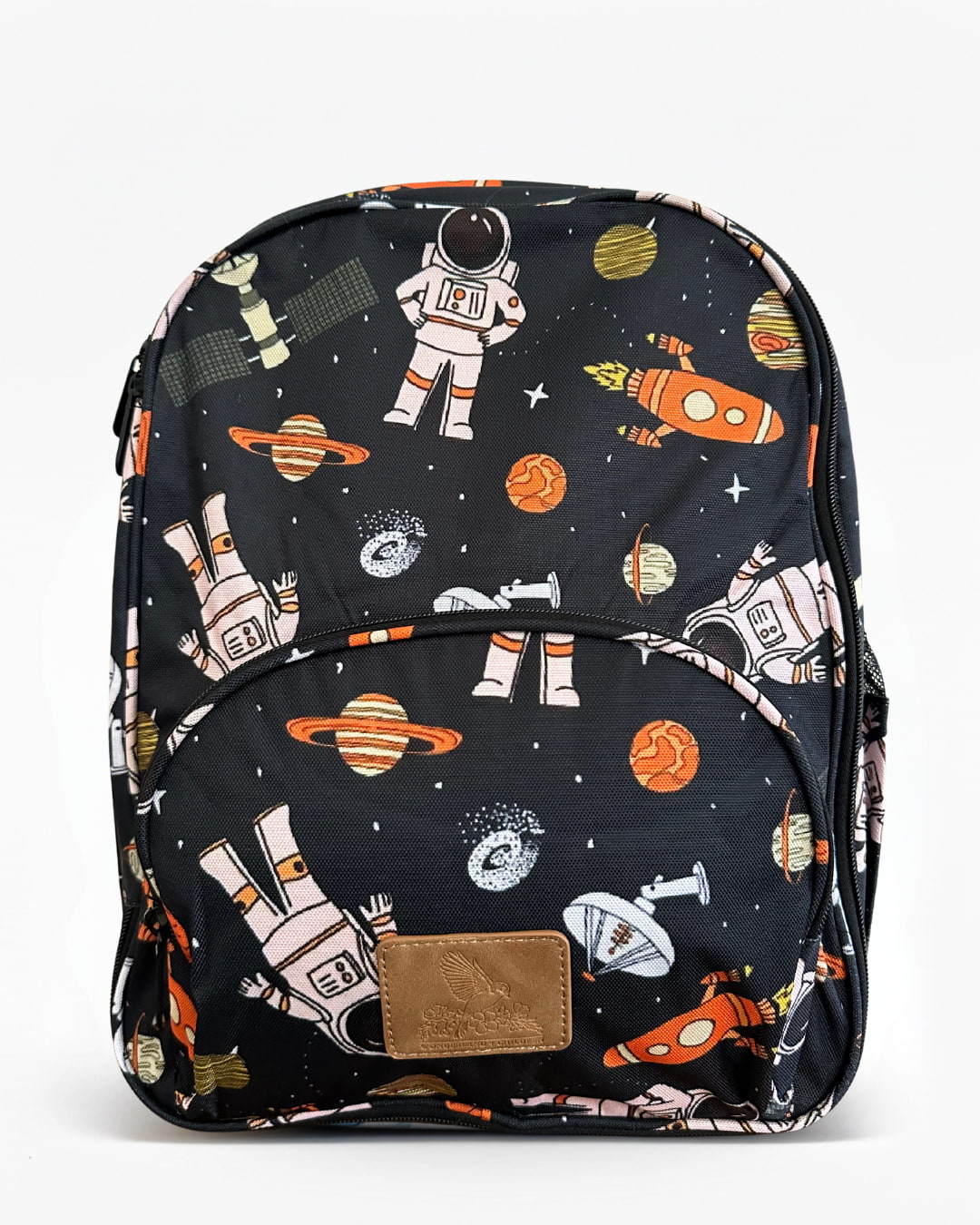 Black kids backpack featuring a space-themed print with astronauts, planets, rockets, and stars, with a front zip pocket on a white background.