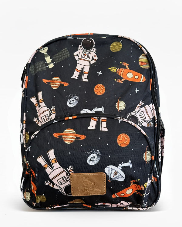 Black kids backpack featuring a space-themed print with astronauts, planets, rockets, and stars, with a front zip pocket on a white background.