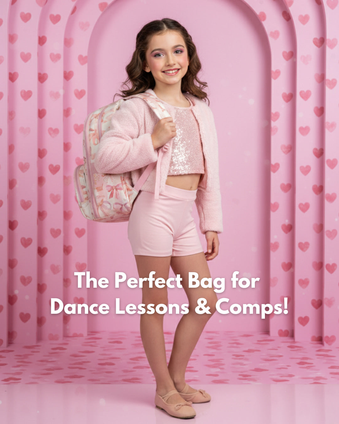 Girl in pink outfit with backpack on heart-patterned background