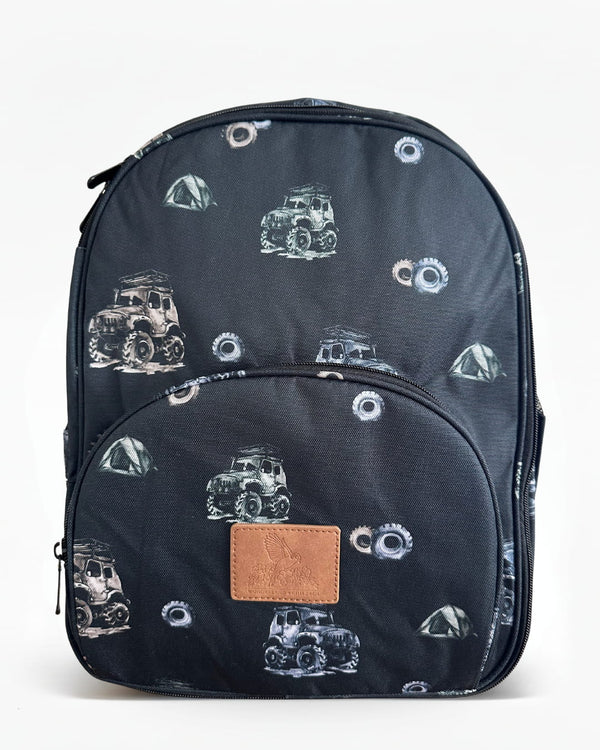 Black kids' backpack featuring an all-over print of trucks, tires, and tents with a front zip pocket and top handle. on a white background