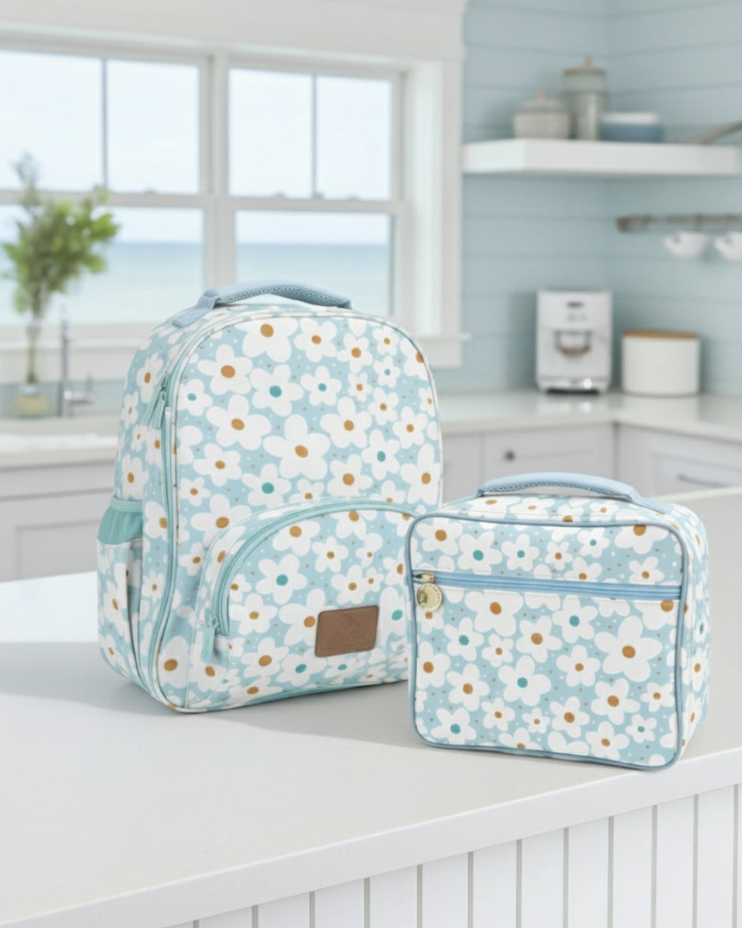 Floral-patterned backpack and lunch bag on a kitchen counter