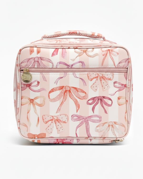 Pink lunch bag with bow pattern on a white background