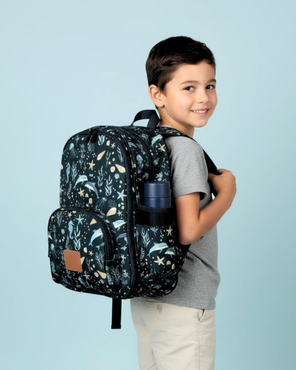 Child wearing a backpack with a nature-themed design on a light blue background
