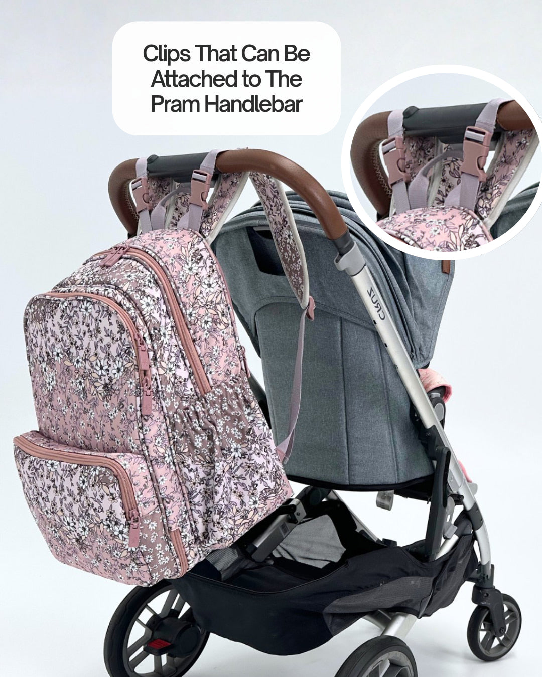 Floral-patterned backpack attached to a stroller with text 'Clips That Can Be Attached to The Pram Handlebar'.