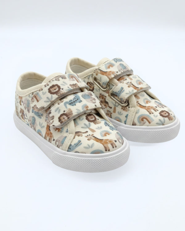 Children's sneakers with animal pattern on a white background