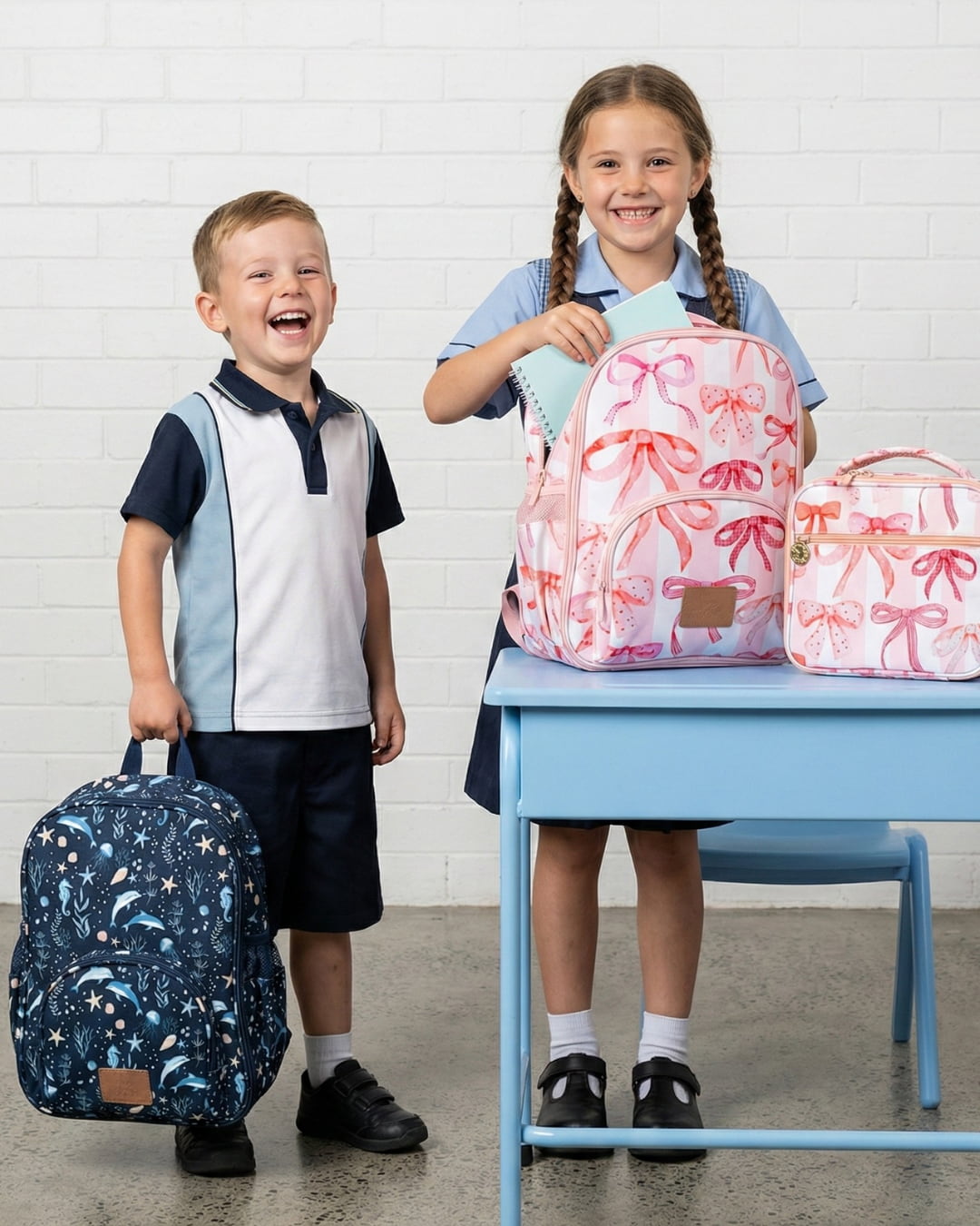 Two children with backpacks in a classroom setting