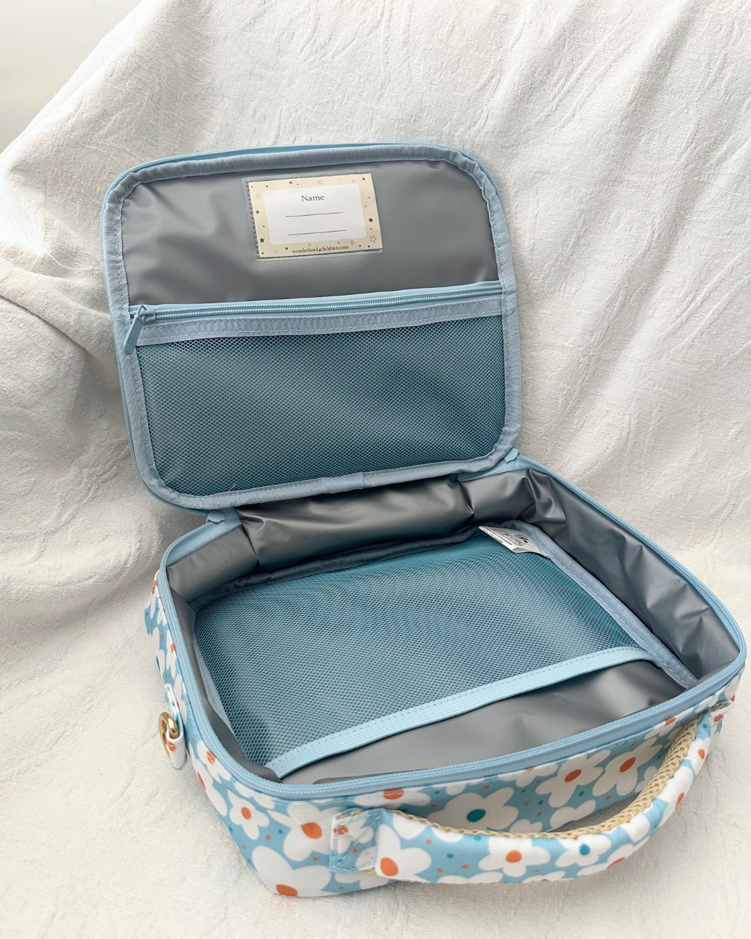 A lunch bag with floral pattern on a white background