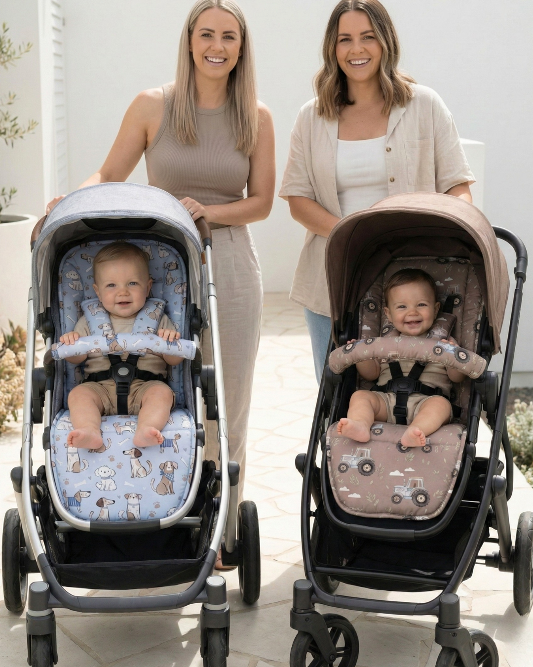 Two women with two baby strollers, one with a blue seat and the other with a brown seat, outdoors.