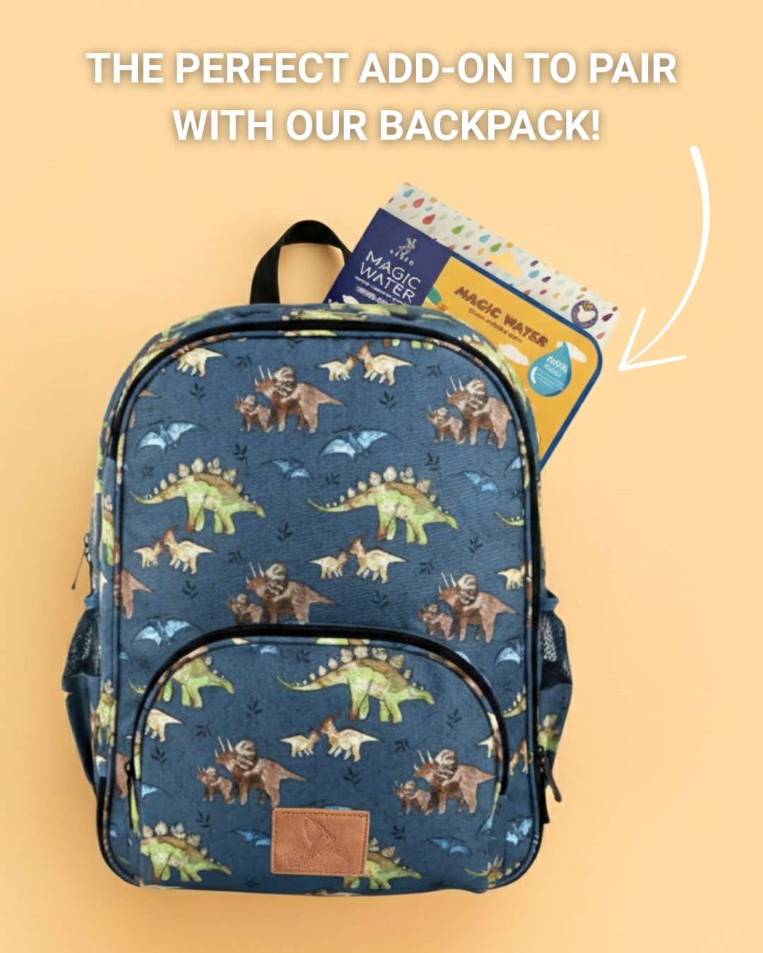 Backpack with dinosaur pattern and Magic Water packaging on a beige background