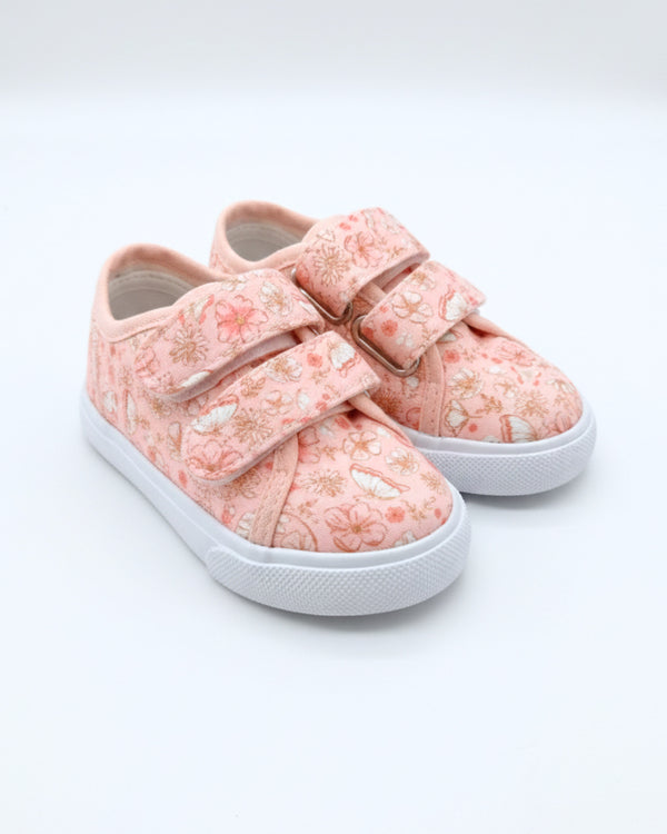 Pink floral sneakers with velcro straps on a white background