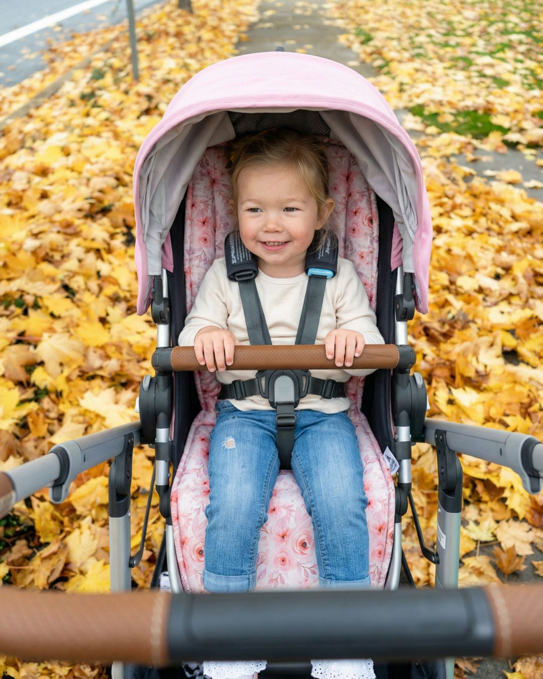 Pink floral universal pram liner Amelia in stroller