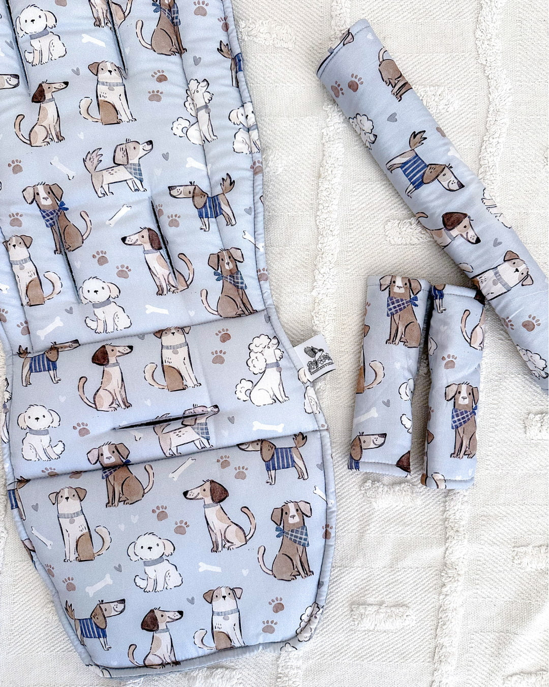 Baby blanket set with dog pattern on a light background