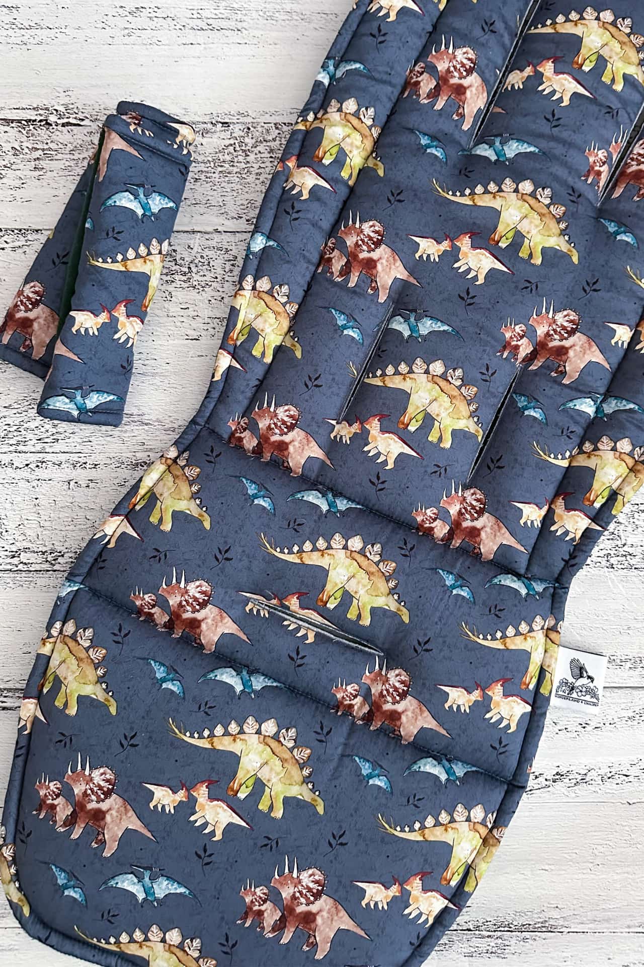 Dinosaur-patterned pram liner