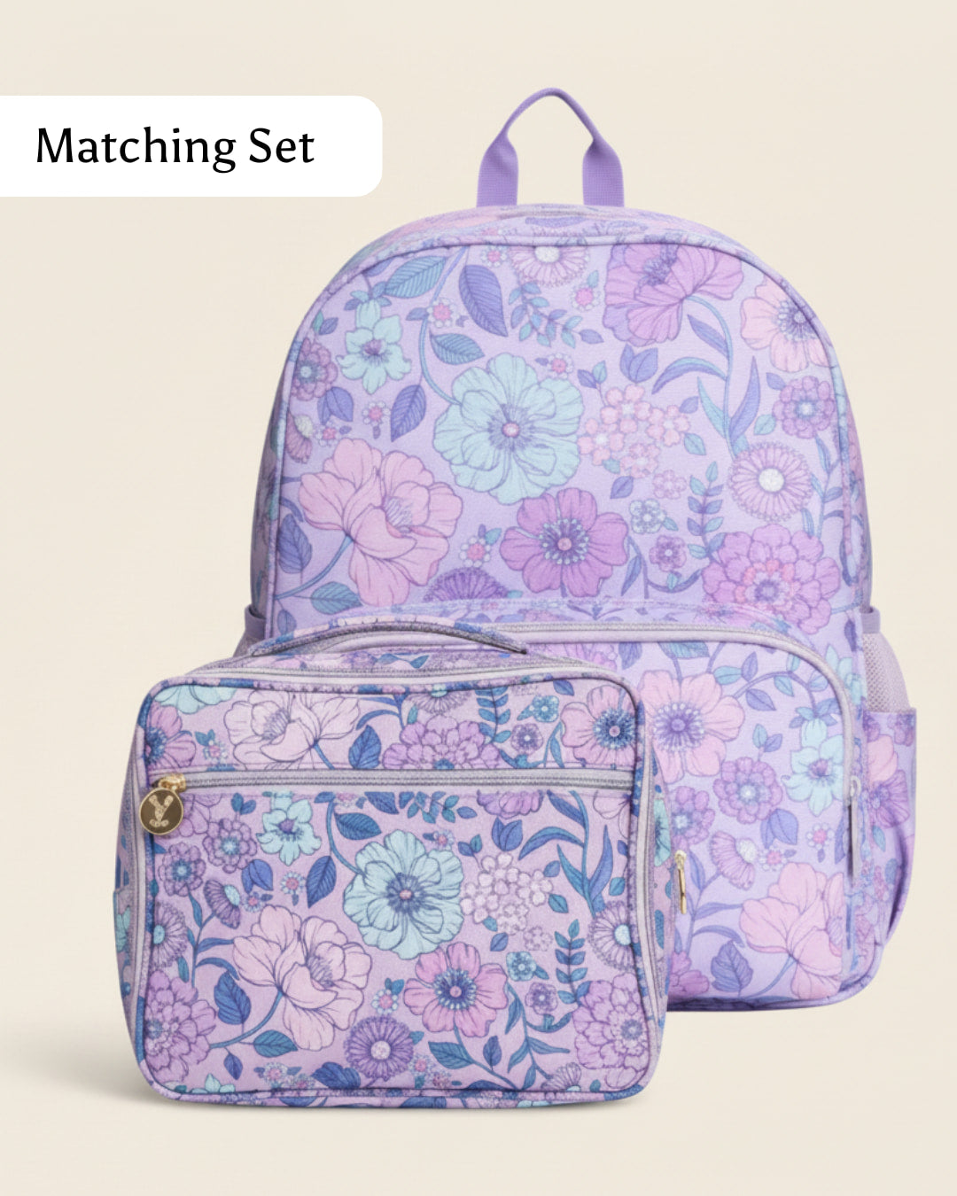 Floral-patterned backpack and lunch bag set on a beige background