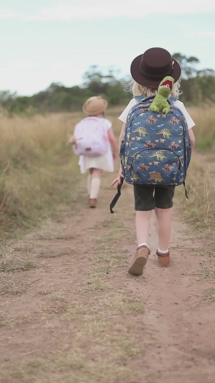 Dinosaur-themed backpack for toddlers featuring blue and green dino graphics